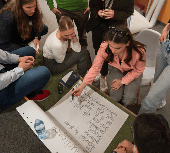 Participants writing on flipchart
