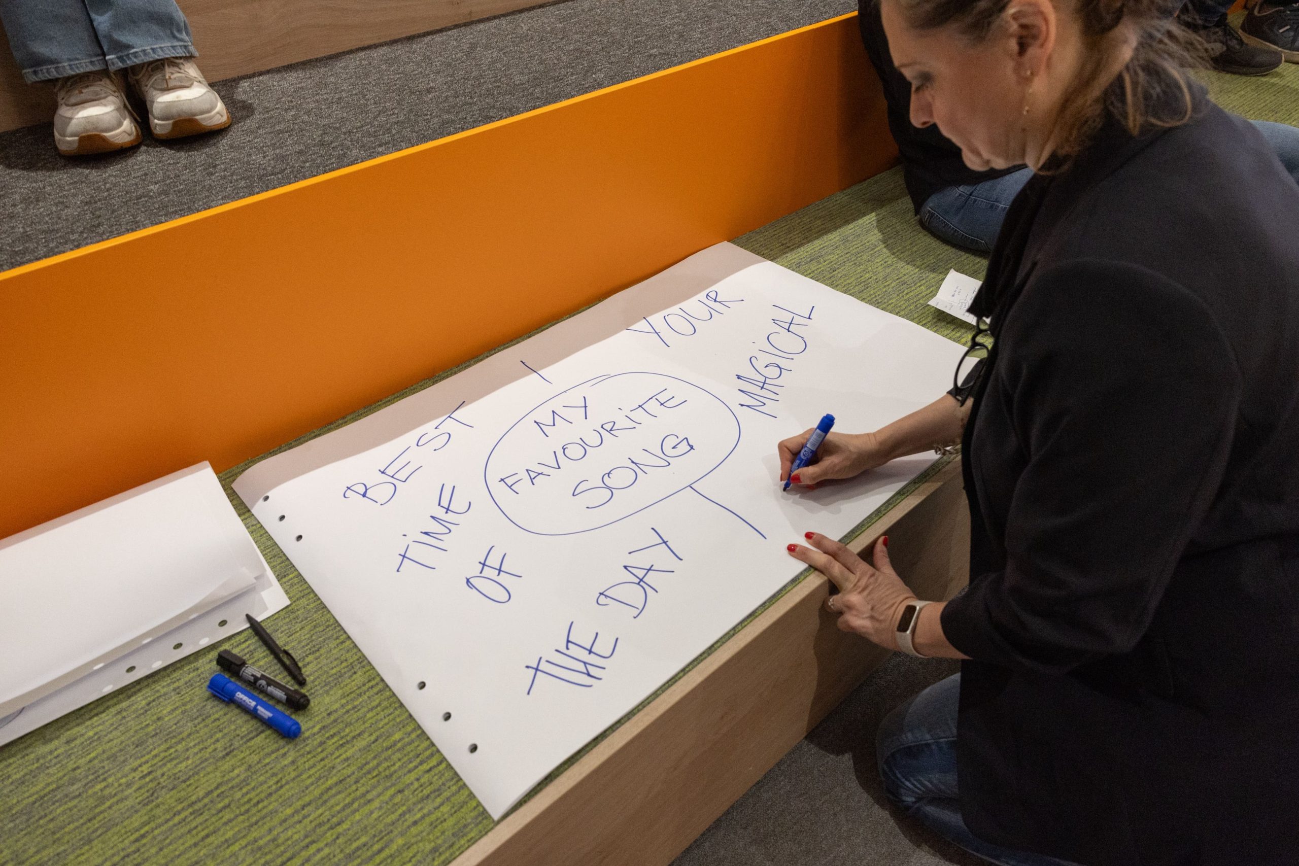 Veronika writing on flipchart